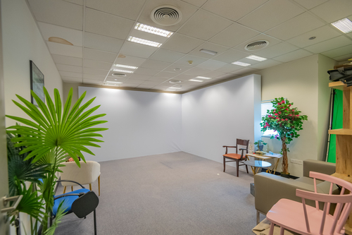Large warehouse with cement floors and high ceiling windows